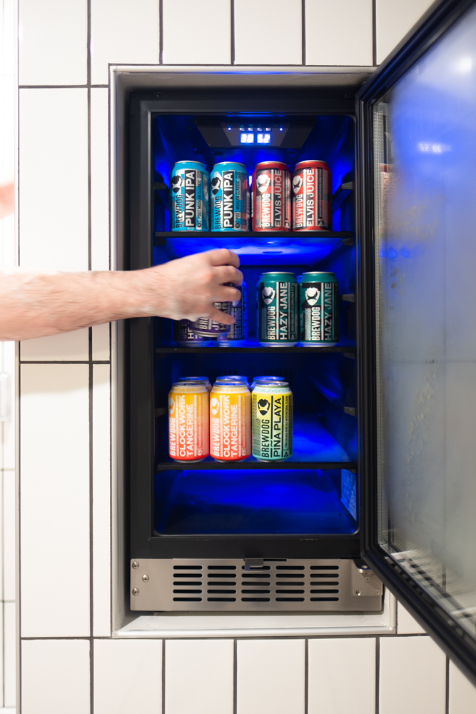 Grabbing a beer from the beer fridge