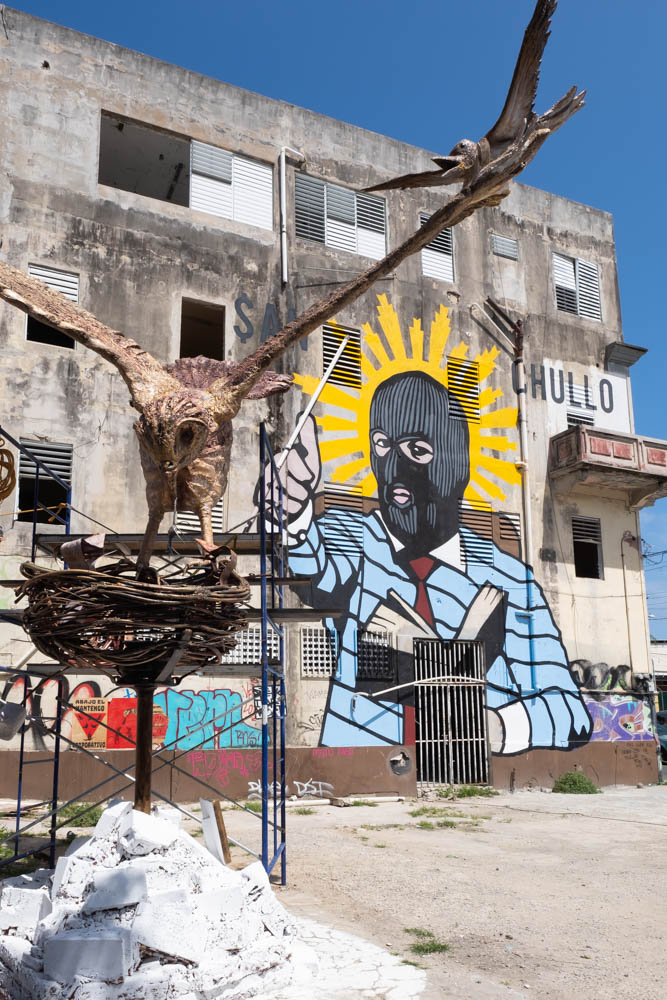 Hooded preacher and eagle sculpture in Santurce